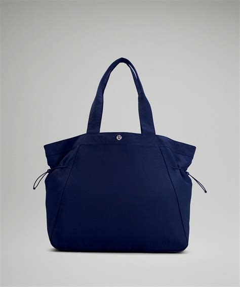 Adjustable side details let you customize the look. . Lululemon in a cinch bag